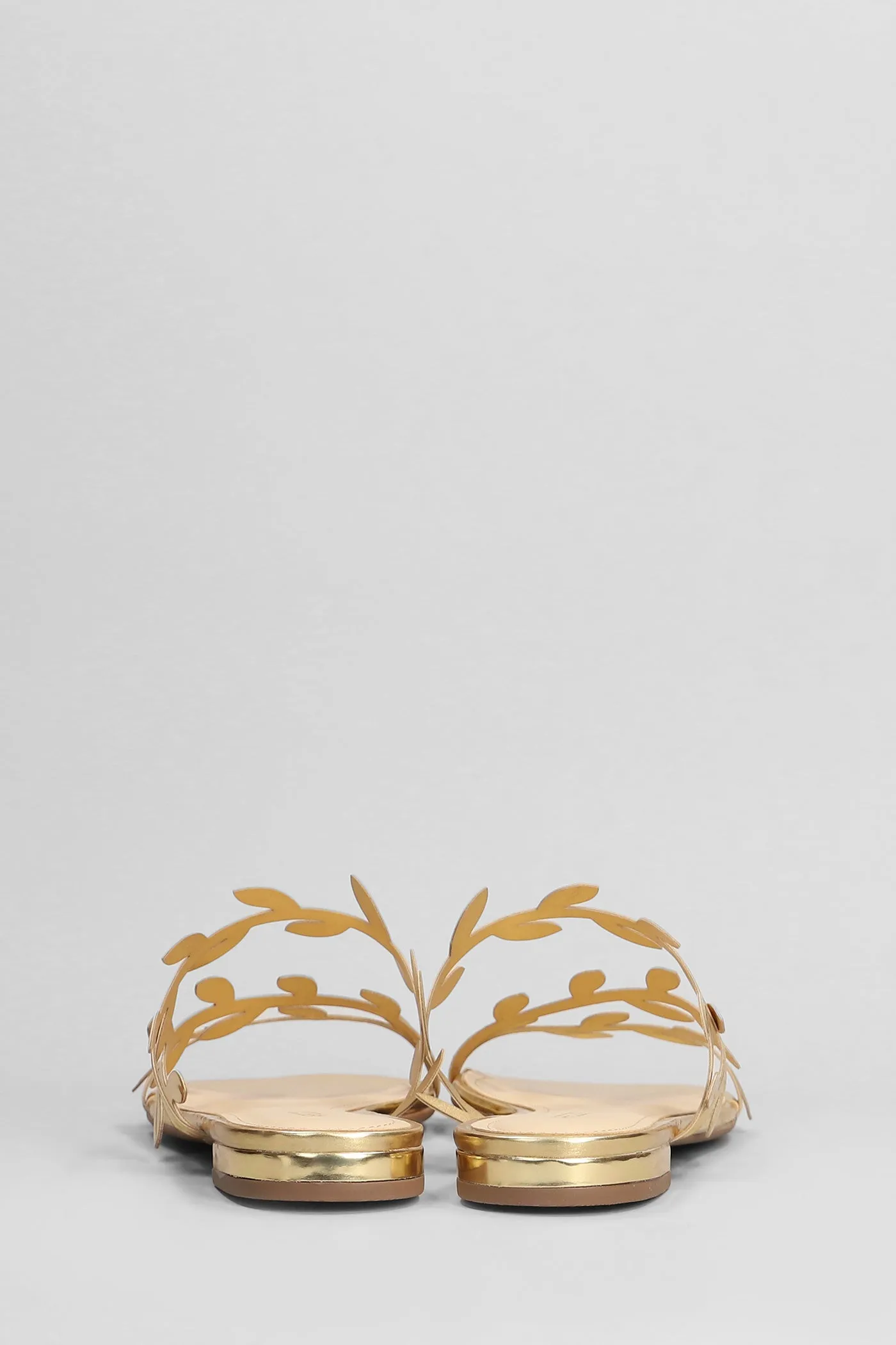 Flats in gold leather
