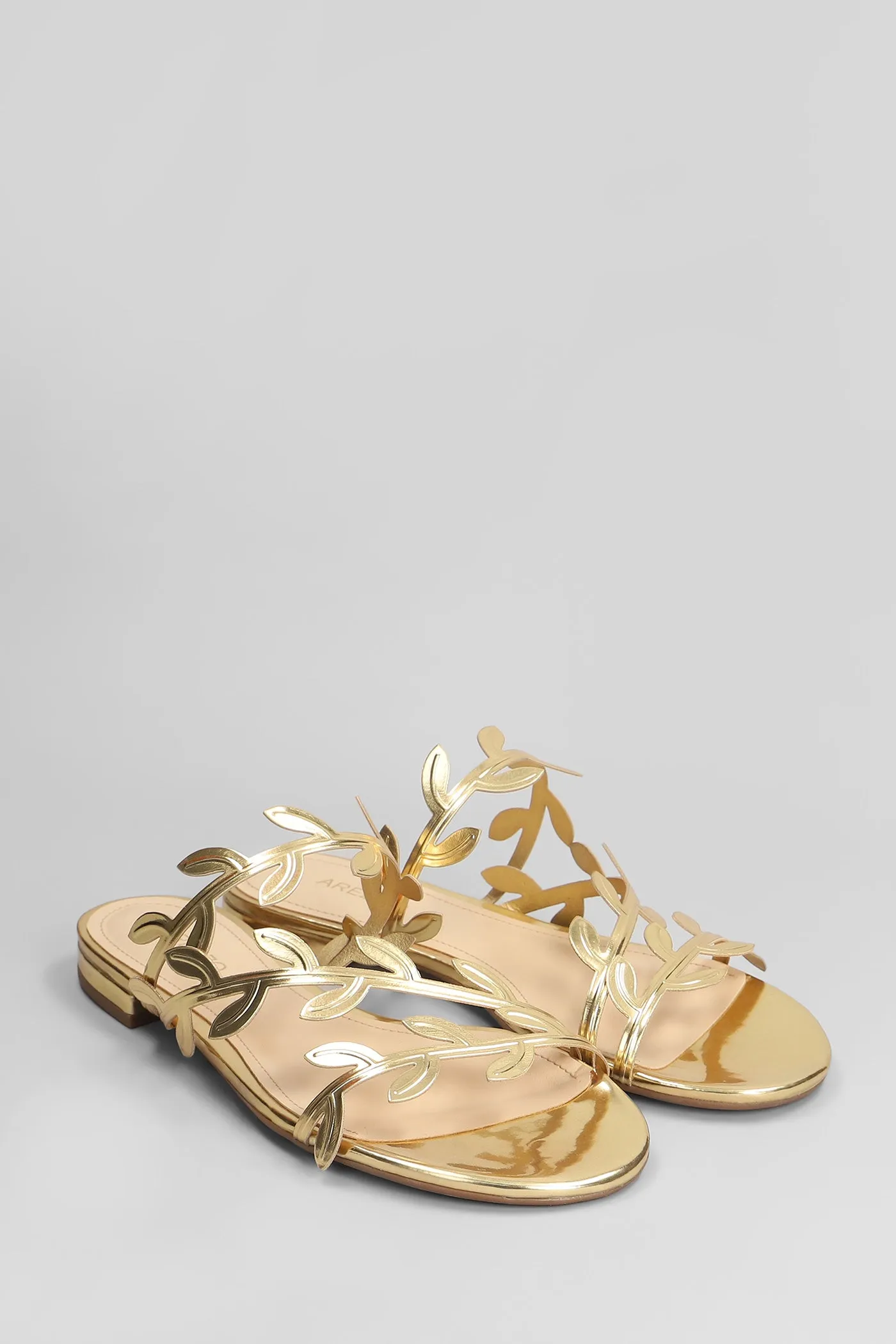 Flats in gold leather