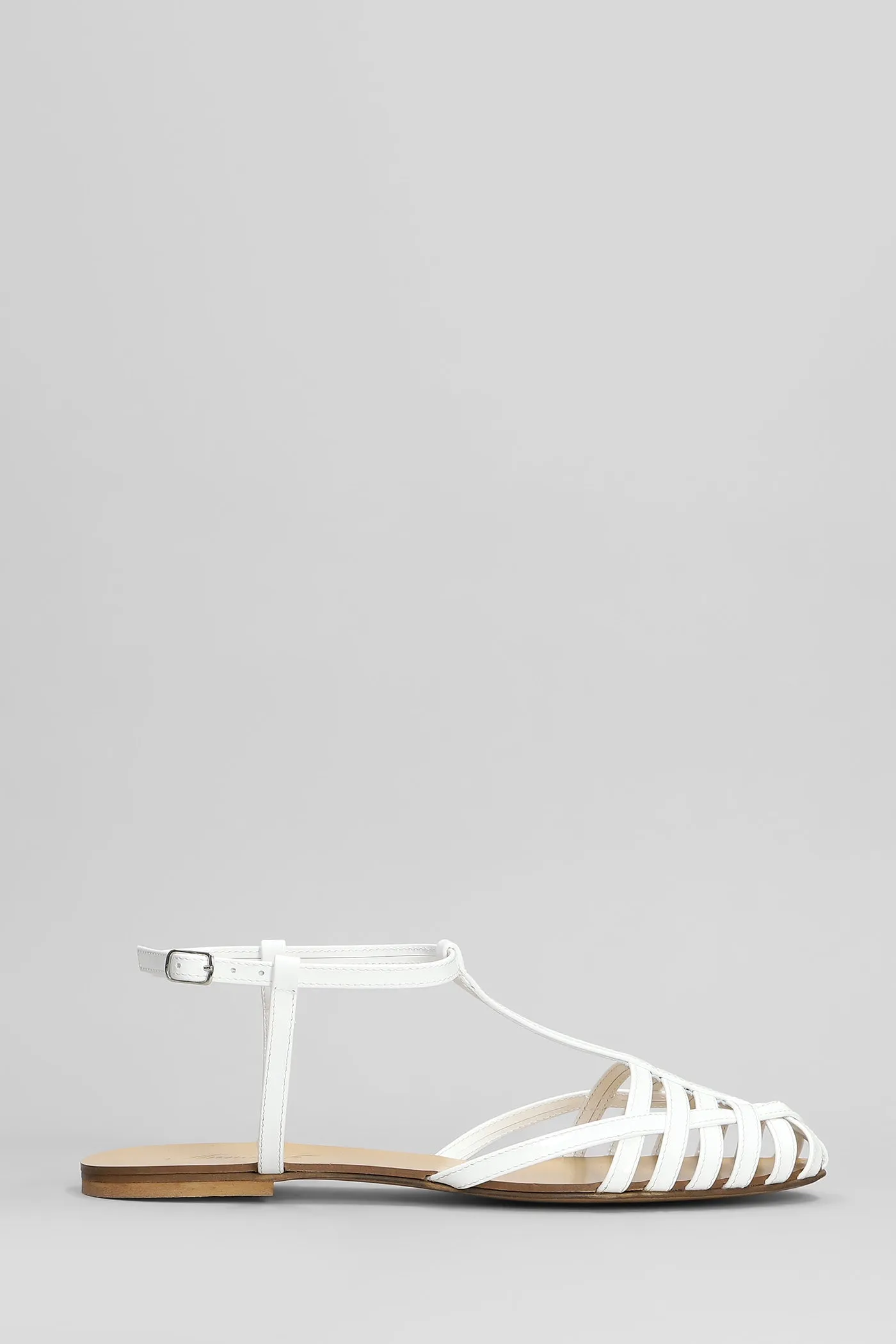 Flats in white patent leather