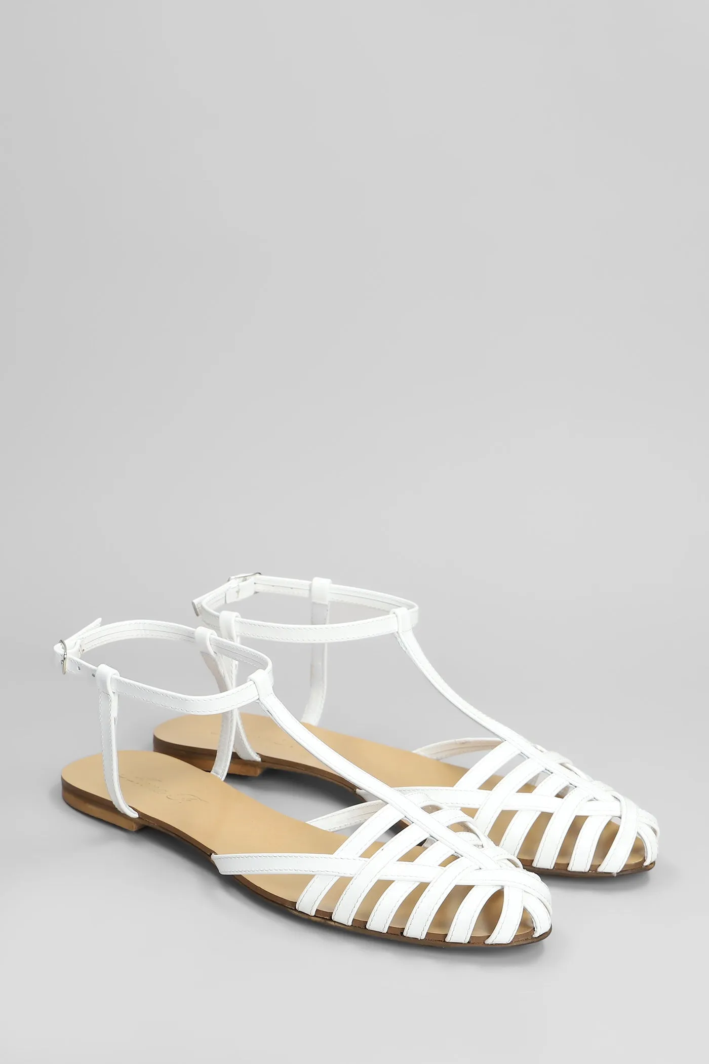 Flats in white patent leather