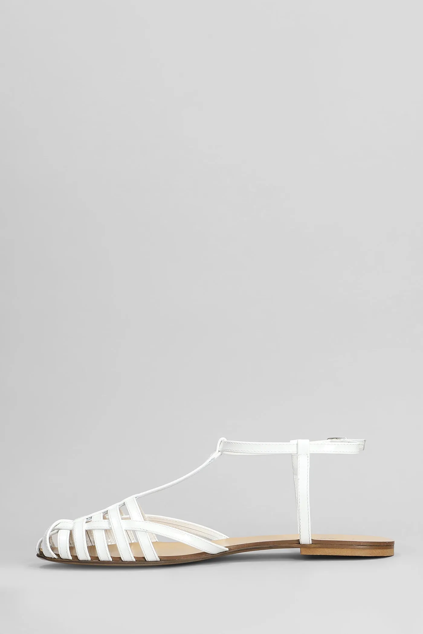 Flats in white patent leather