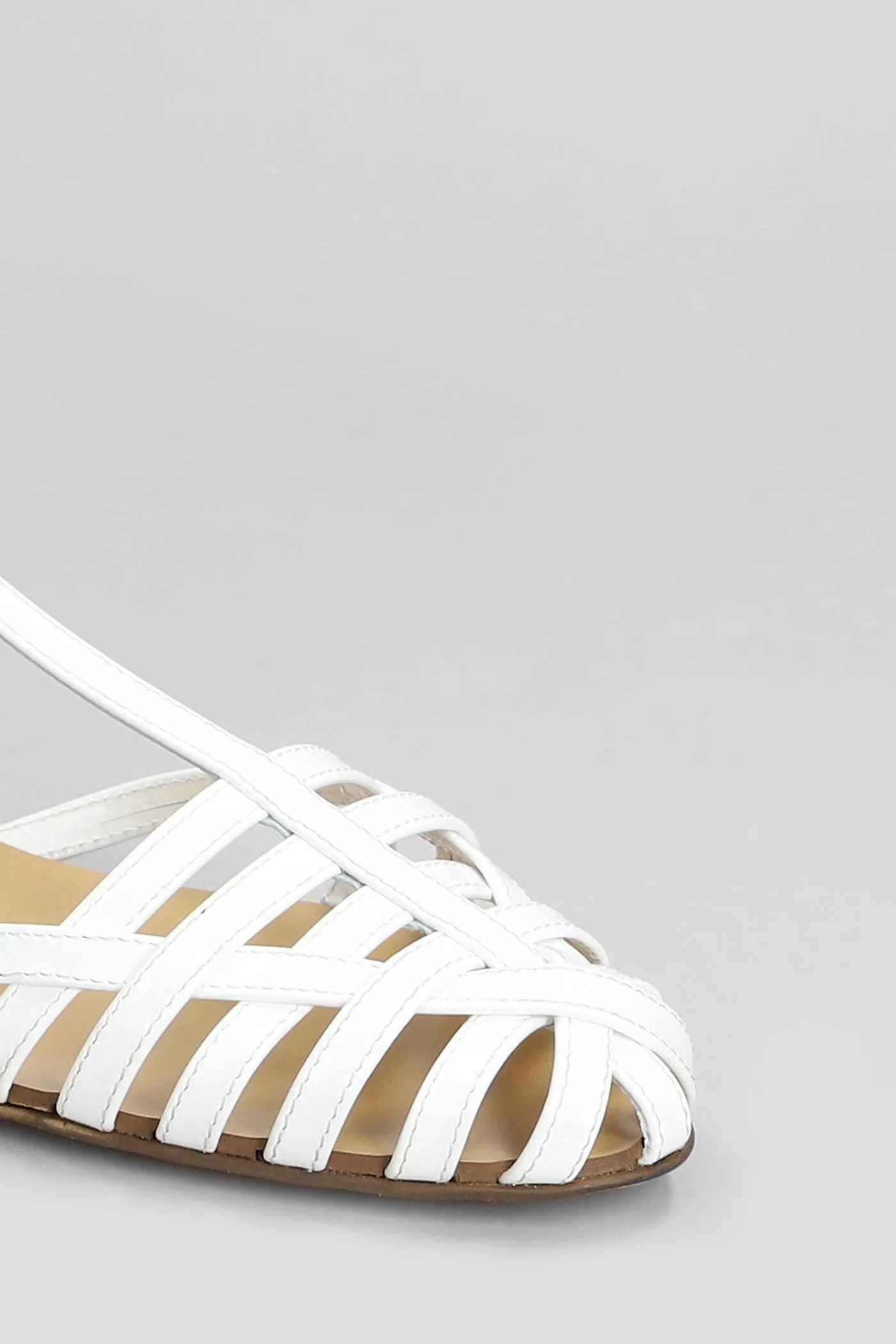 Flats in white patent leather