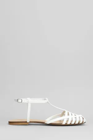 Flats in white patent leather